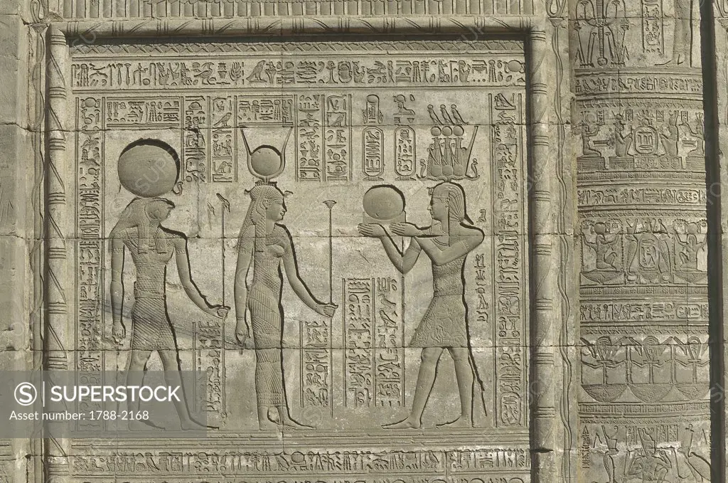 Egypt - Dandarah (Dendera). Temple of Hathor. Celebrating royal birth 'mammisi' building, reigning Trajan. Relief of pharaoh offering to gods Hathor and Horus. Initiated Ptolemaic dynasty, Ptolemy XII, 88-51 BC