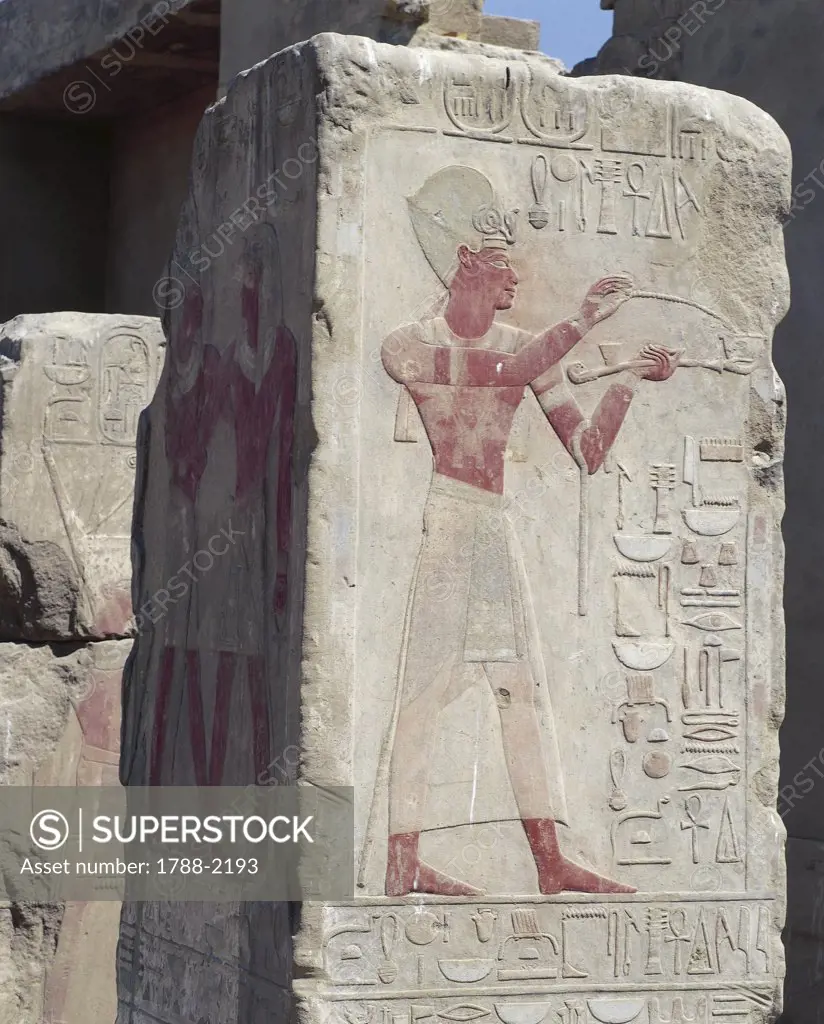 Egypt - Ancient Thebes (UNESCO World Heritage List, 1979). Karnak, Open Air Museum. Pillar. Painted relief of king burning incense as ritual offering