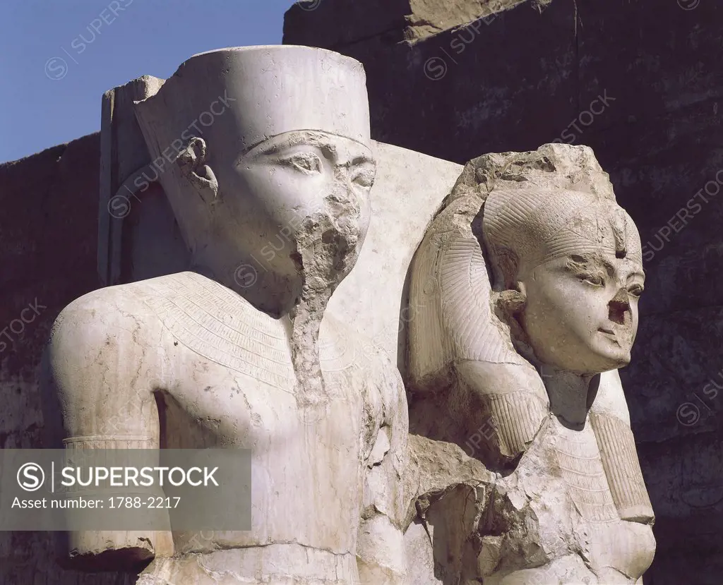 Egypt - Ancient Thebes (UNESCO World Heritage List, 1979). Luxor. Temple of Amon. Limestone statuary group of Tutankhamen and Queen. New Kingdom, 18th Dynasty