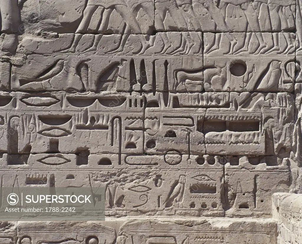 Paleography - Egypt - Ancient Thebes (UNESCO World Heritage List, 1979) - Medinet Habu - Mortuary temple of Ramses III (1184-1153 b.C.), second pylon. Relief detail with hieroglyphs of pharaoh's military campaigns.