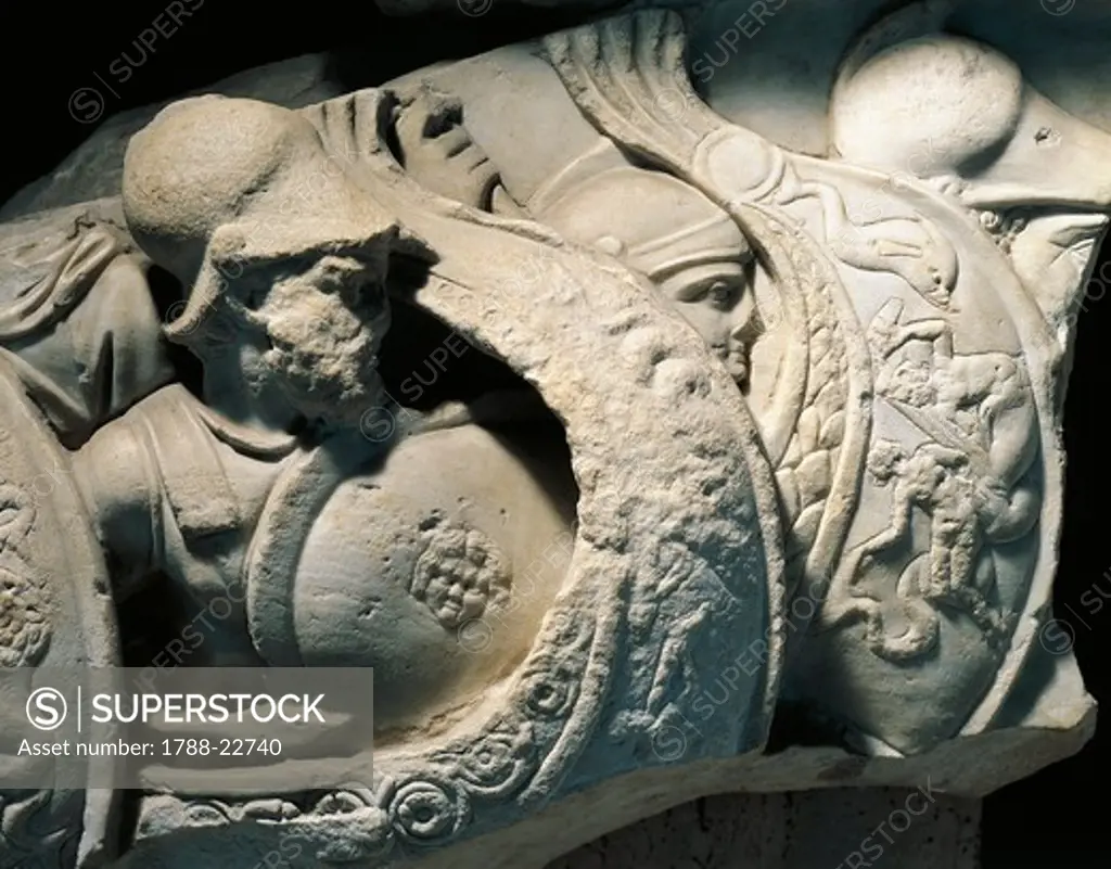 Italy, Apulia, Fragment of a sarcophagus representing a naval battle between Greeks and Trojans, (Detail of soldiers), stone relief