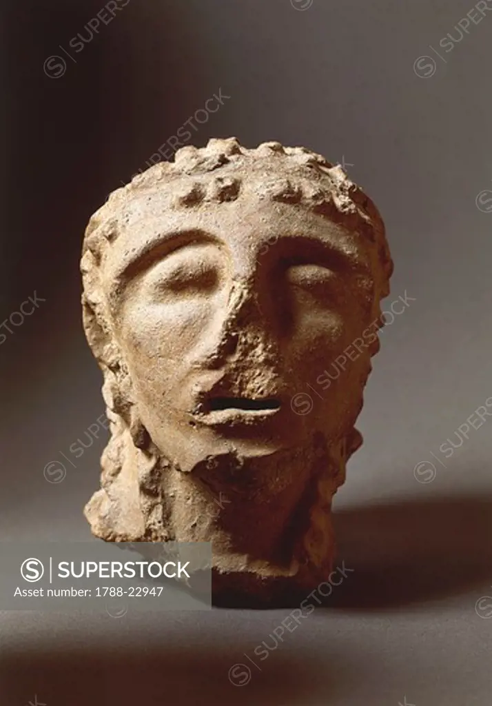 Italy, Tuscany, Part of an acroterium (architectural ornament) representing a male head, from the second palace of Murlo, terracotta work