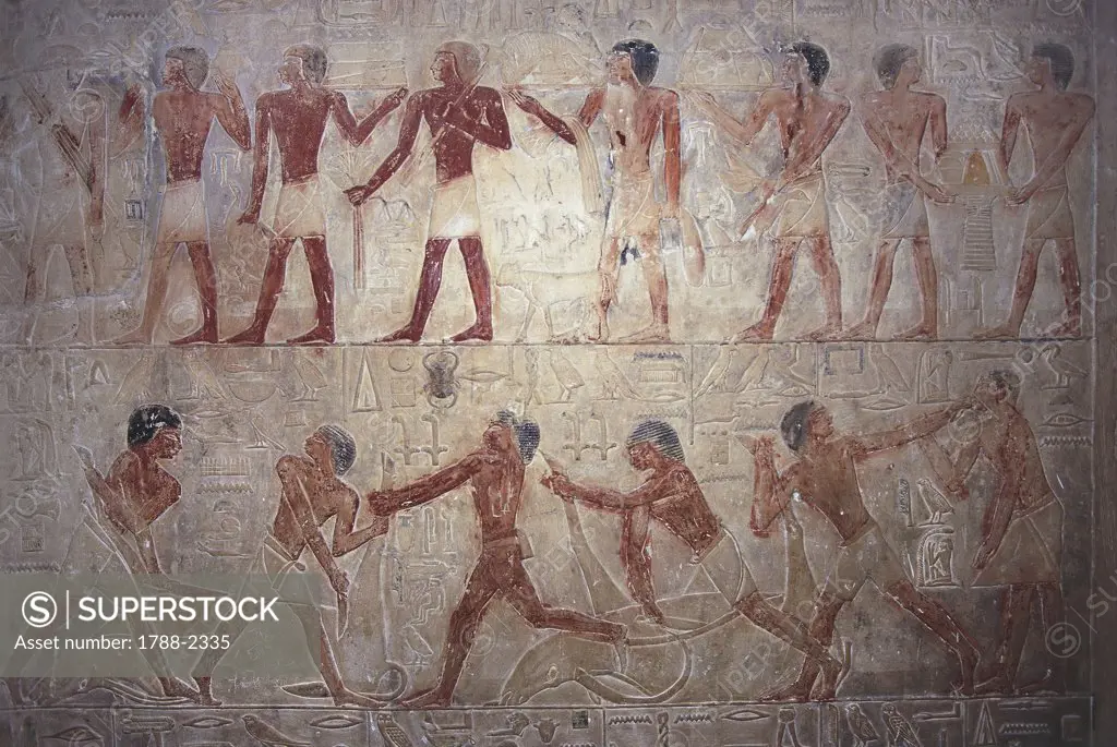 Egypt - Cairo - Ancient Memphis (UNESCO World Heritage List, 1979). Saqqara. Necropolis. Private funerary mastaba of Ptahhotep, 5th Dynasty. Relief depicting, from top to bottom, offering bearers and men butchering cattle