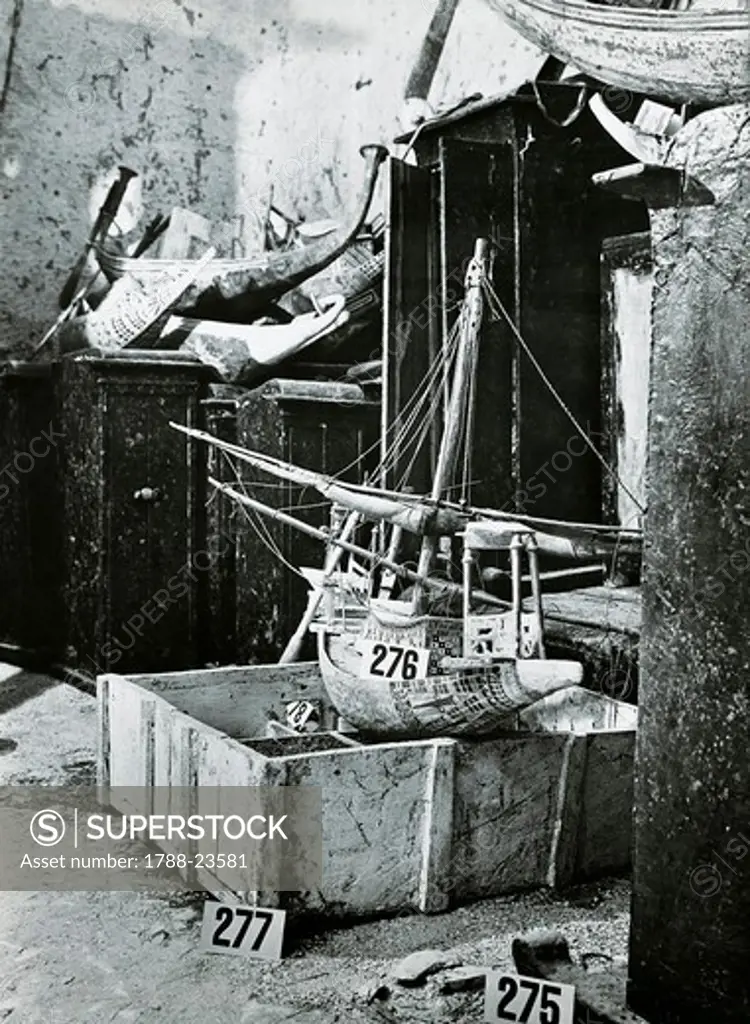 Egypt, Valley of the Kings, The discovery of the tomb of Pharaoh Tutankhamun (or Tutankhamen, circa 1340-1323 B.C.), pieces of the treasure, statuettes, cases, a boat model, and a little granary, 1922, vintage photograph