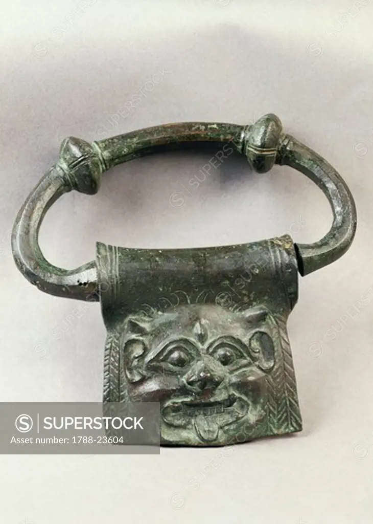 Handle decorated with a Gorgon head, bronze