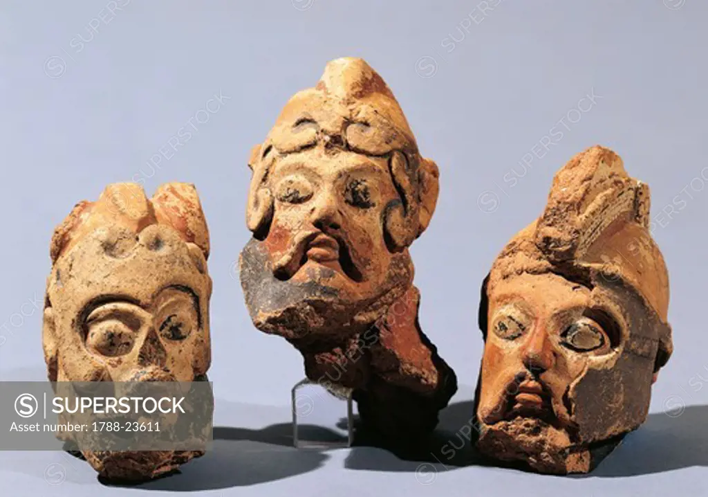 Sculptures representing warrior heads, painted terracotta, 510 A.C..