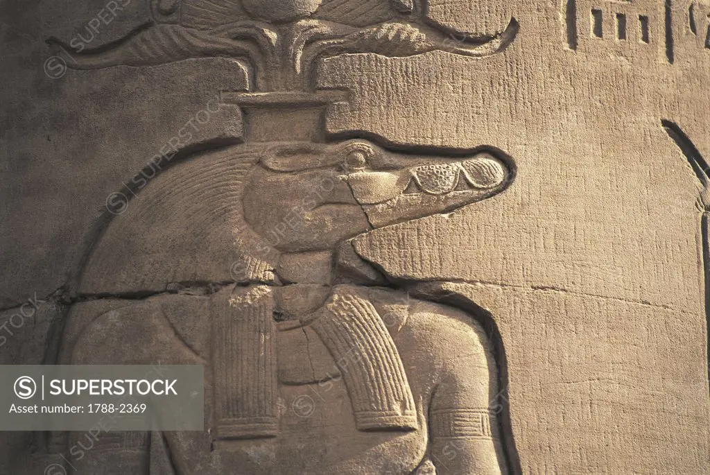Egypt - Kawn Umbu (Kom Ombo). Ancient Ombos. Temple of Sebek and Haroeris. Relief of crocodile headed god Sebek
