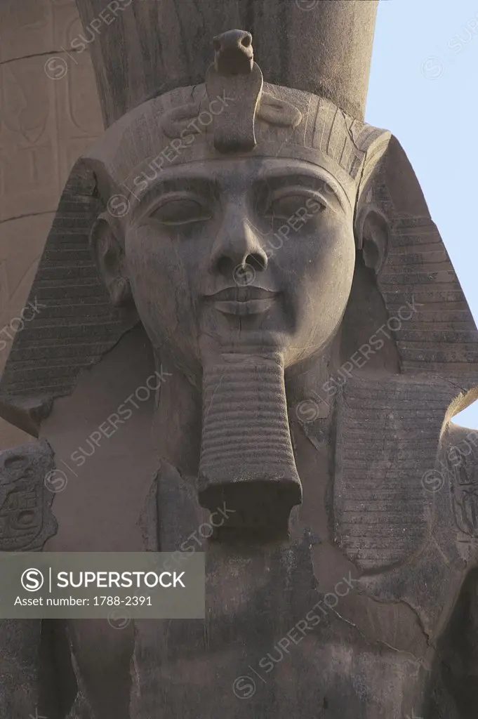 Egypt - Ancient Thebes (UNESCO World Heritage List, 1979). Luxor. Temple of Amon. Colossal statue of Ramses II, 1290-1224 BC. Detail image