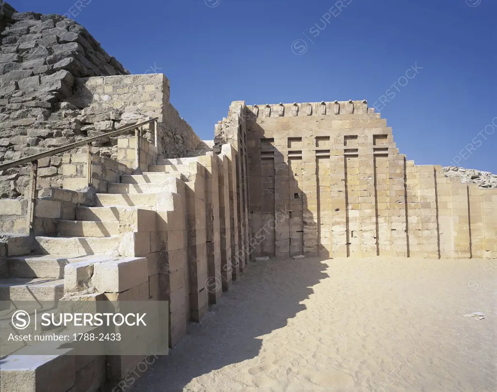 Egypt - Cairo - Ancient Memphis (UNESCO World Heritage List, 1979). Saqqara. Funerary monument to king Djoser 'Step Pyramid', Old Kingdom, 5th Dynasty. Cobra Wall.