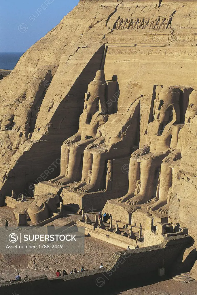 Egypt. Nubian monuments at Abu Simbel (UNESCO World Heritage List, 1979). Great Temple. Colossal four sandstone figures of Ramses II