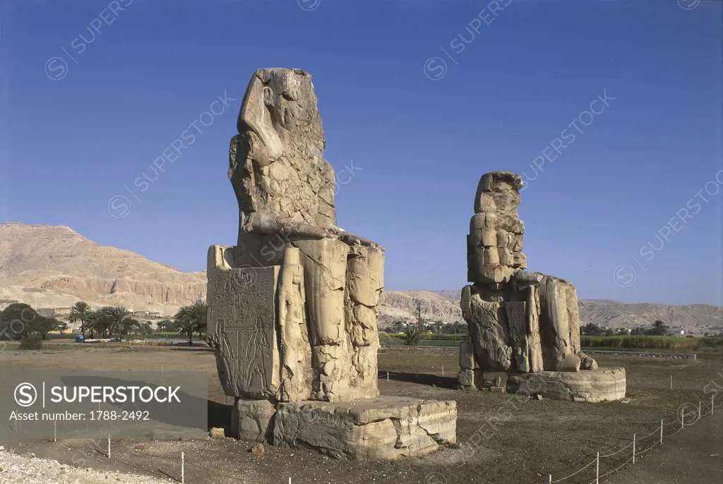 Egypt - Ancient Thebes (UNESCO World Heritage List, 1979). Statues of Amenhotep III 'Colossi' of Memnon
