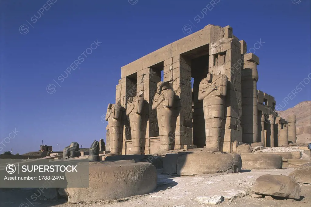 Egypt - Ancient Thebes (UNESCO World Heritage List, 1979). Valley of the Kings. Funerary temple of Ramses II 'Ramesseum'. Figures of Osiris at inner court pillars