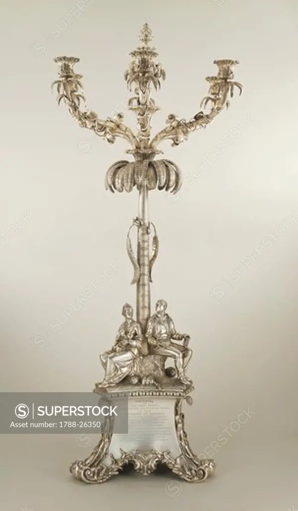 Silversmith's Art, Great Britain 19th century. Silver six-branched candlestick, Victorian style.
