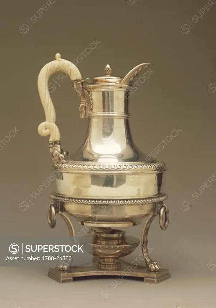 Silversmith's Art, Great Britain 19th century. Silver coffepot with pot-shaped stand and burner.