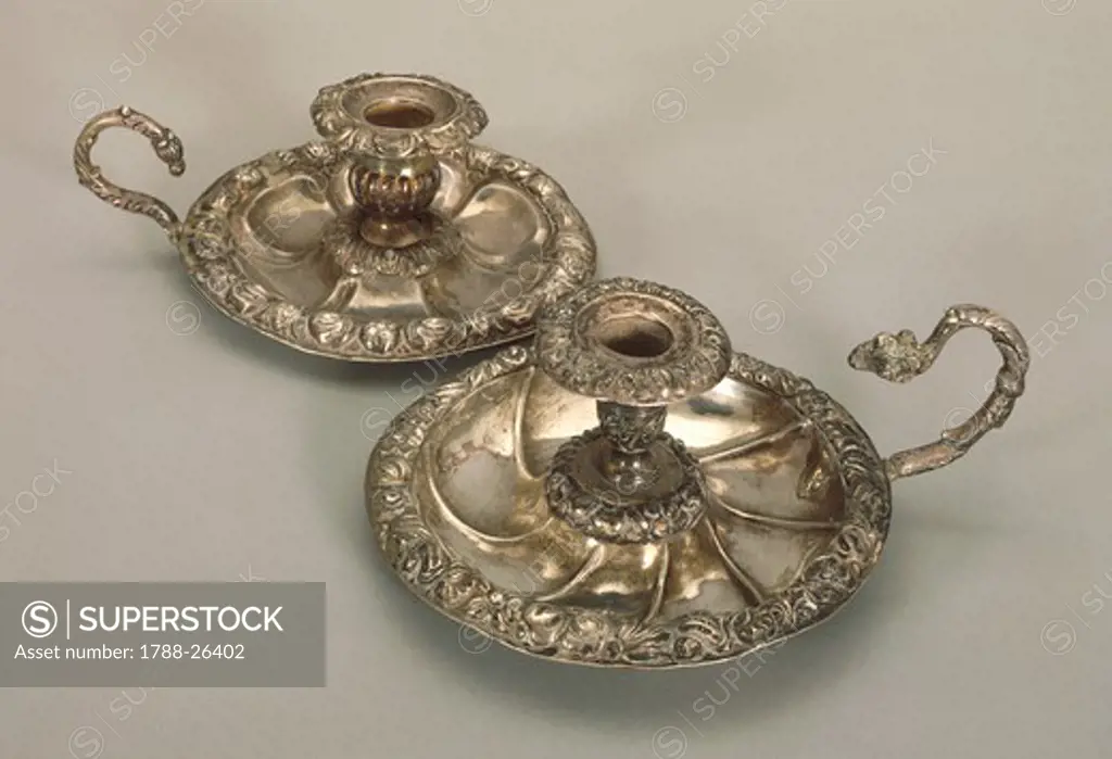 Silversmith's Art, Italy 19th century. Silver candlesticks with embossed borders with floral motifs.