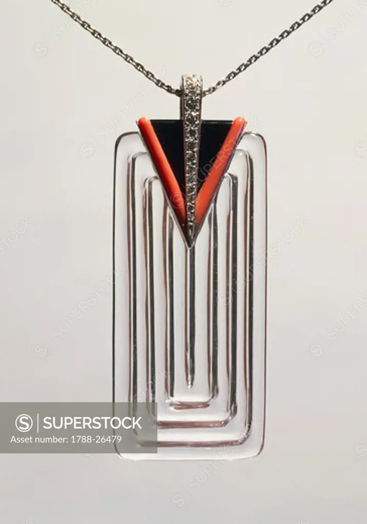 Goldsmith's art, 20th century. Art Deco carved rock crystal pendant, with triangular black enamel, diamond and coral setting.
