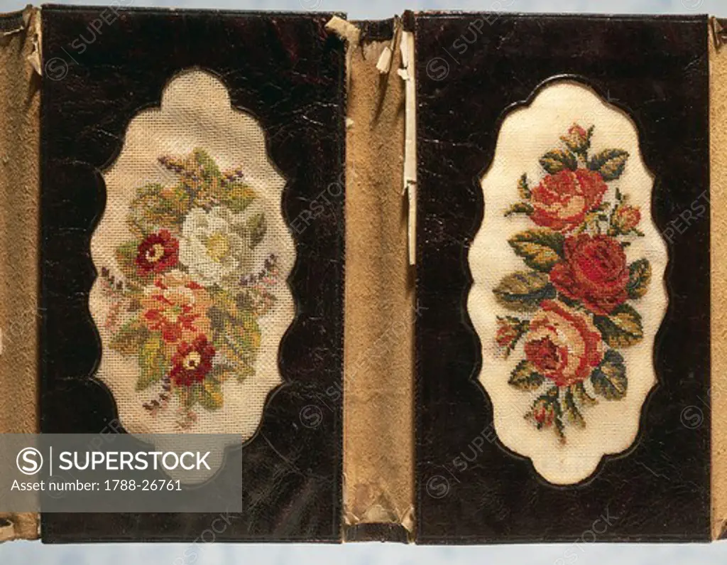 Embroidery, 19th century. Leather wallet with floral motifs,  embroidered in small stitch on linen.