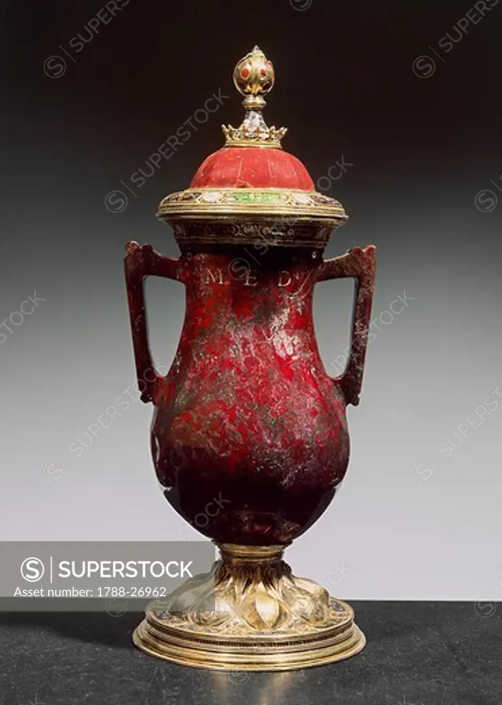 Silversmith's art, Italy, 15th century. Red jasper, enamelled gilded silver vase with two handles and lid. Height cm. 42. Signed LAV.R.MED.