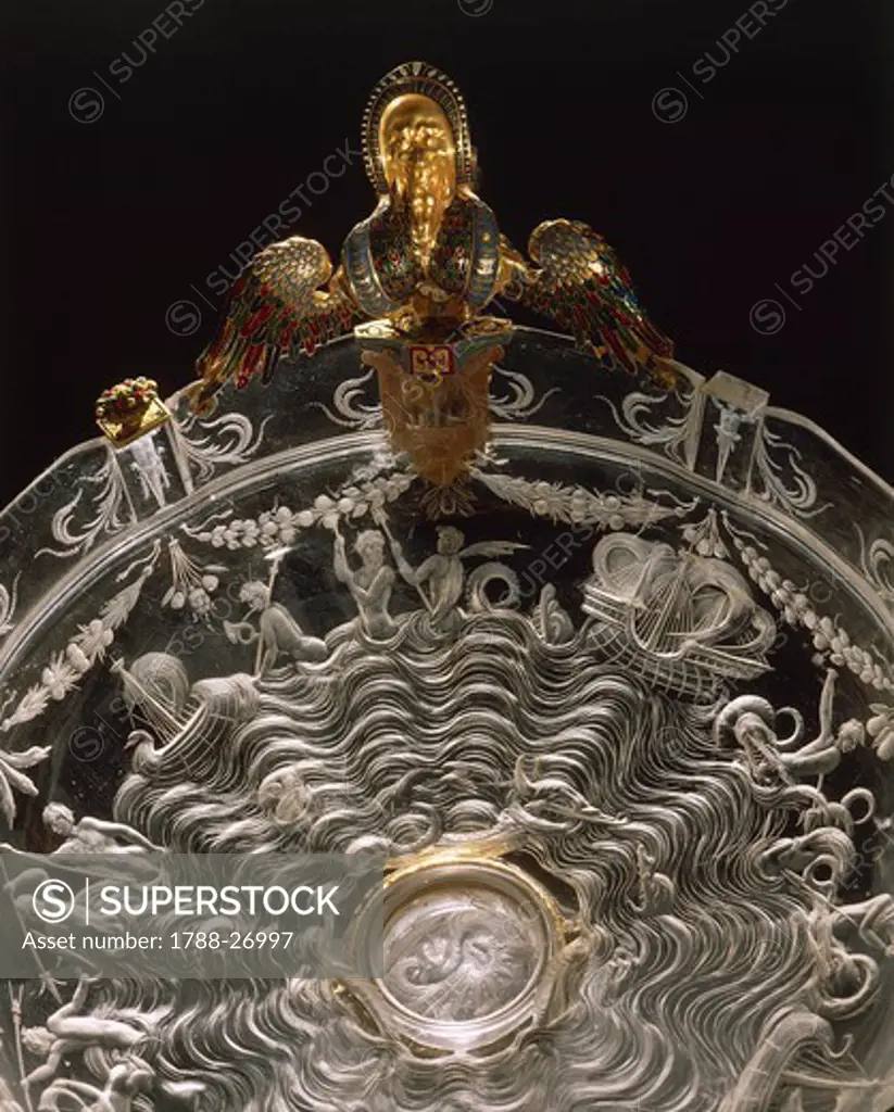 Goldsmith's art, Italy, 16th century. Rock crystal and enamelled gold cup. Height cm. 19. Milanese manufacture. Detail of the engraving depicting sea divinities fighting among ships.
