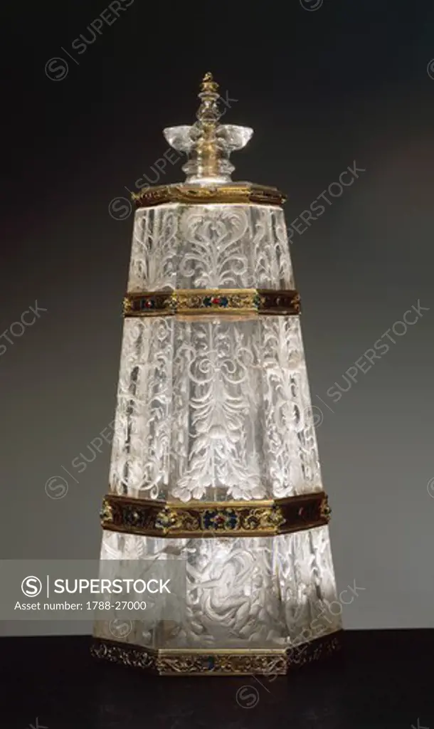 Goldsmith's art, Italy, 16th century. Hexagonal rock crystal flask with enamelled gold and gilded silver bands. Height cm. 26.3