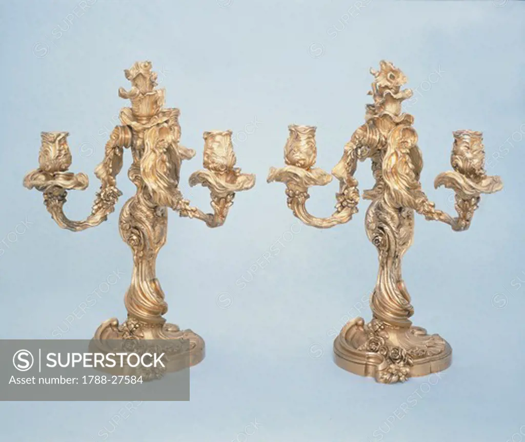 Silversmith's art, France, 18th century. Pair of three branch silver candelabra.