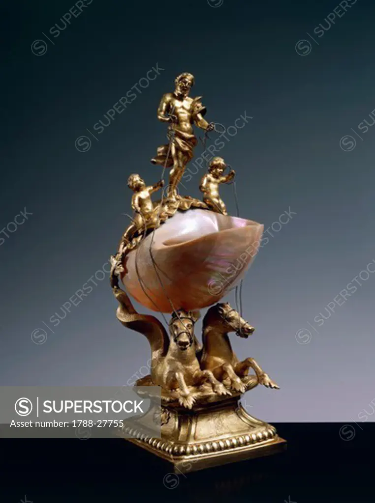 Goldsmith's art, Germany, 17th century. Nautilus salt cellar supported by two gilded bronze sea horses and surmounted by figure of god Neptune and two Puttos. Gilded bronze mount. Height cm. 33.