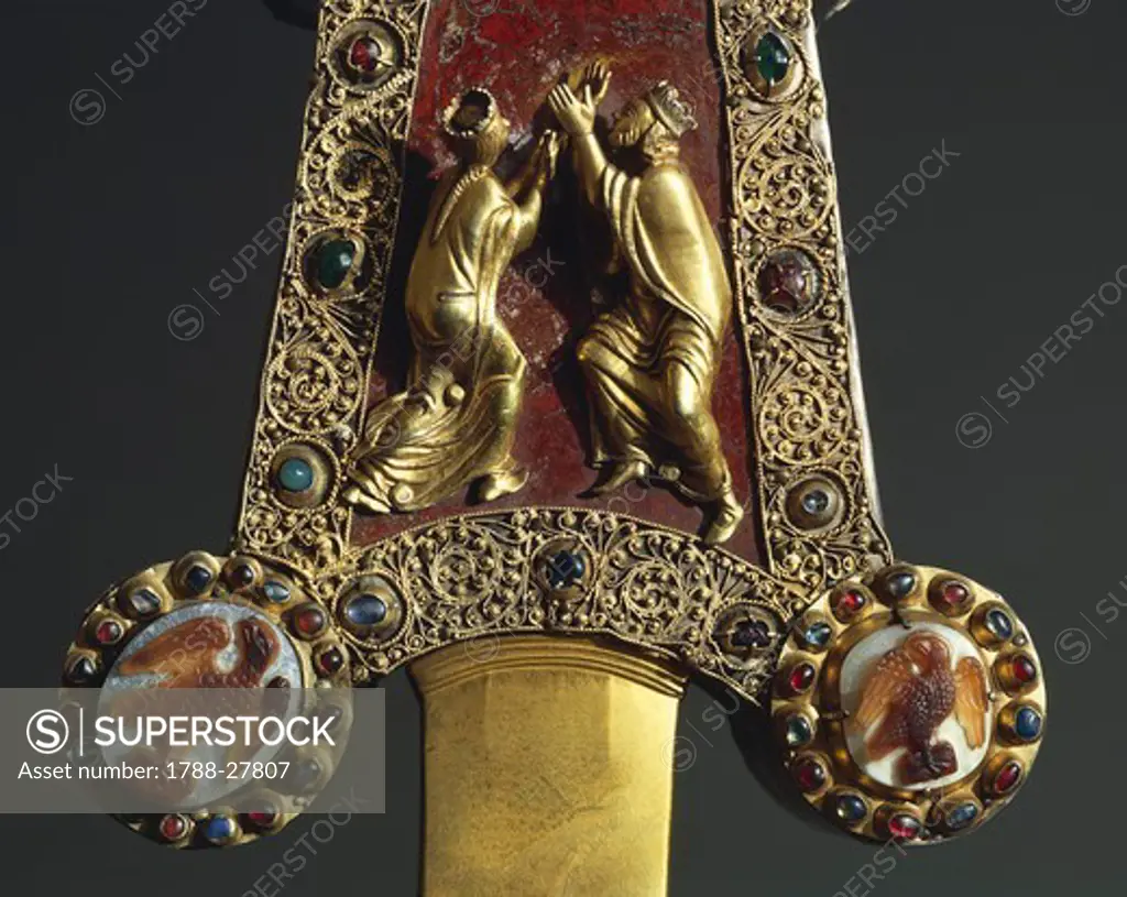 Goldsmith's art, 13th century. Processional cross in red jasper, gold and gems. Donated by Otto Visconti to Abbot Paolo da Besana, 1296. Front side. Detail.