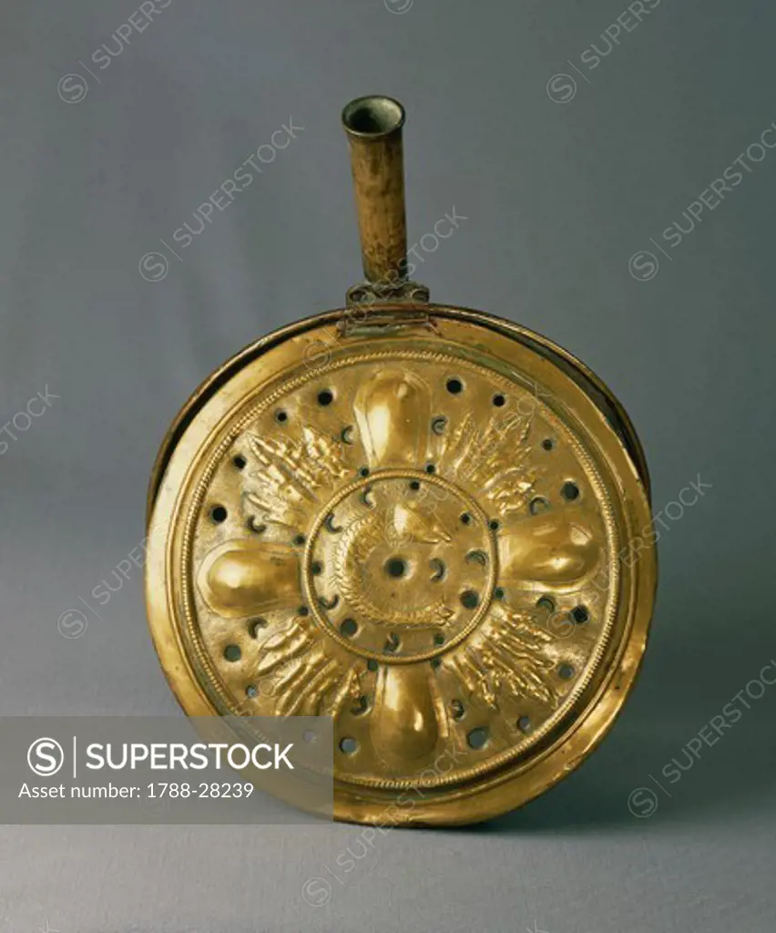 Goldsmith's art, Italy, 17th century. Brass warming pan from Lombardy region.