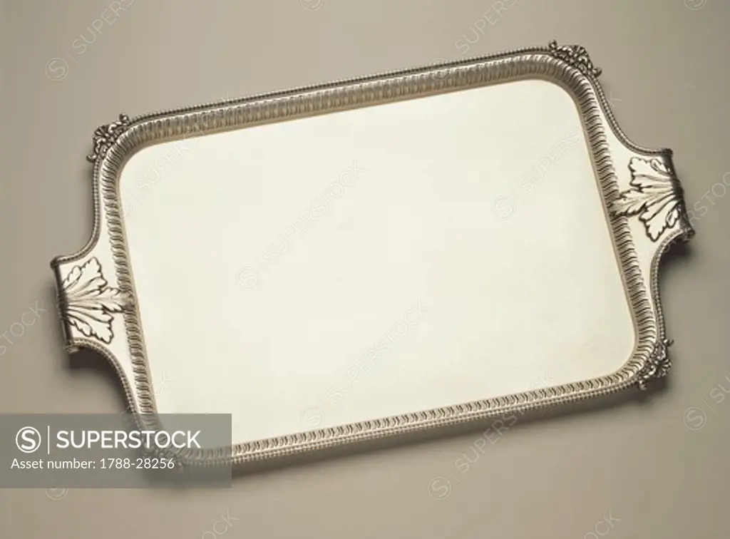 Silversmith's Art, England 19th century. Sheffield plate tray with wrought, pierced border and handles with volutes and leaves in relief. approximately 1830.