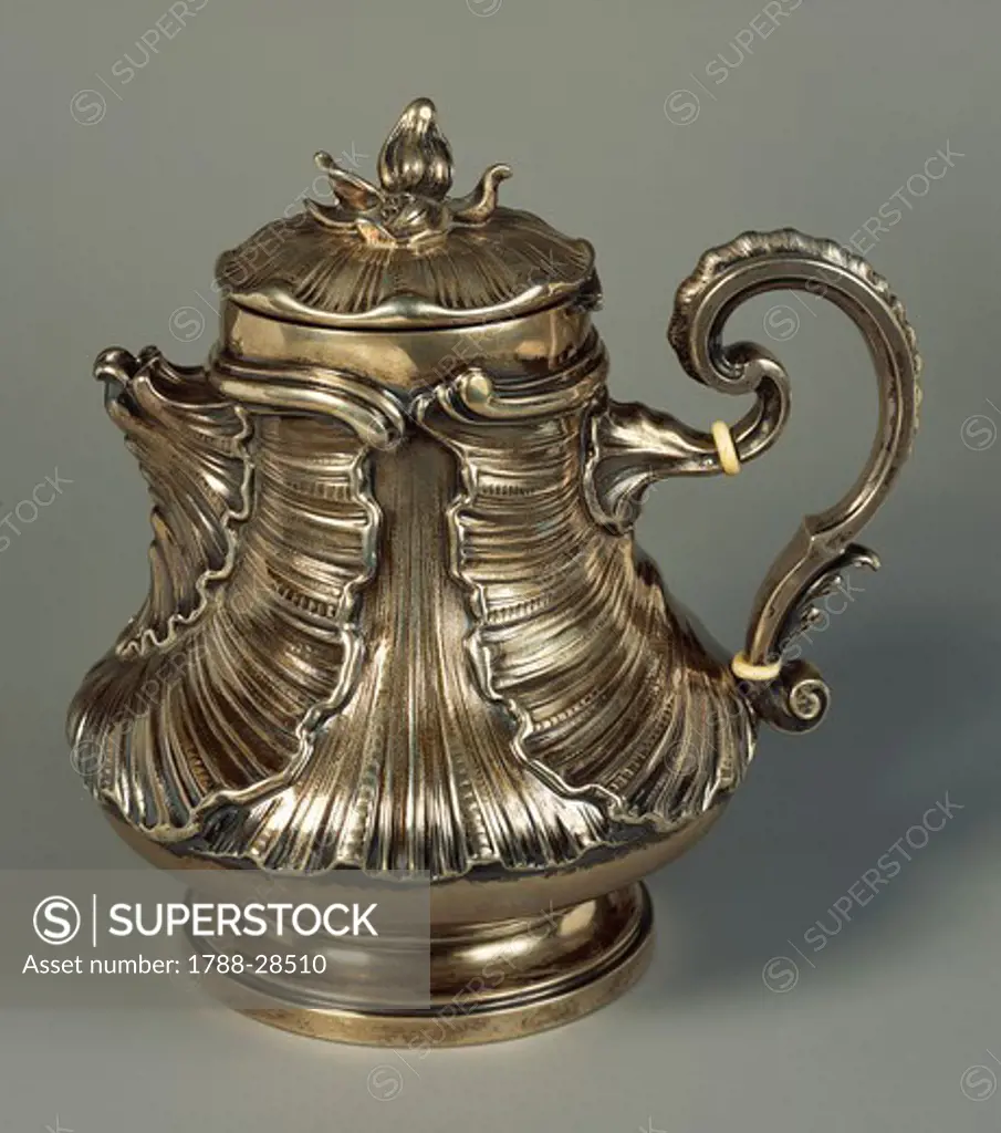 Silversmith's Art, Italy 20th century. Mario Buccellati, Silver chocolate jug with embossed leaves and flower-shaped knob, based on the drawing of the illustrated Marabout in the Encyclopedie of Diderot and D'Alembert. Milan-Rome, approximately 1925.