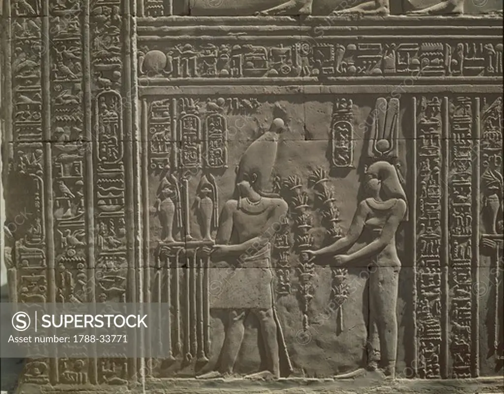 Paleography - Egypt - Kom Ombo. Bas-relief in the temple of Kom Ombo representing Ptolemy II Euergetes and the Queen Cleopatra making offerings to Gods