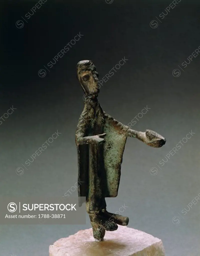 Nuragic civilization, 8th century b.C. Bronze figure of a woman bearing offerings. From Sardinia Region.