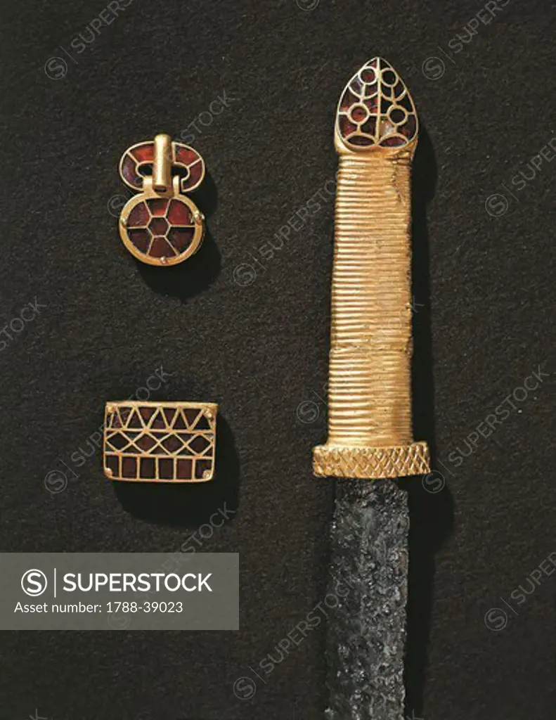 Barbarian civilizations, France, 5th century. Goldsmith's art. Treasure of Pouan, princely burial of a Germanic warrior. Cloisonne' enamel and gold dagger handle and clasps.
