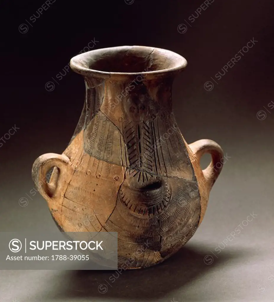 Nuragic civilization. Pear-shaped pitcher with engraved decorations. From Sardinia Region.
