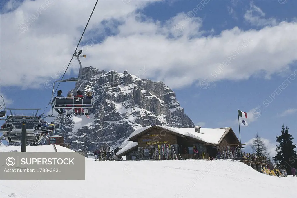 Group of people on a ski lift, Alleghe, Dolomites, Veneto, Italy