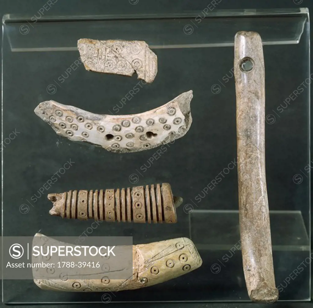 Italic civilizations, Piceni, 9th century b.C. Decorated handles in bone and tusk of wild boar.
