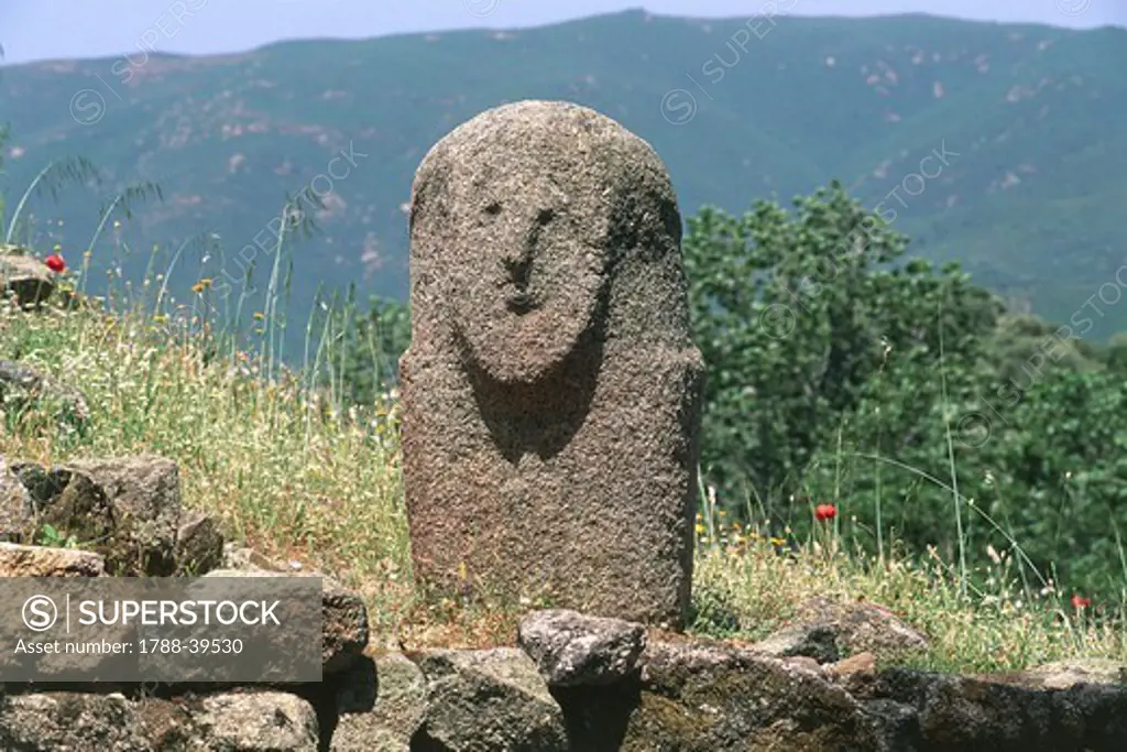 France - Corsica - Filitosa prehistoric archaeological site. Anthropomorphic menhir statue.