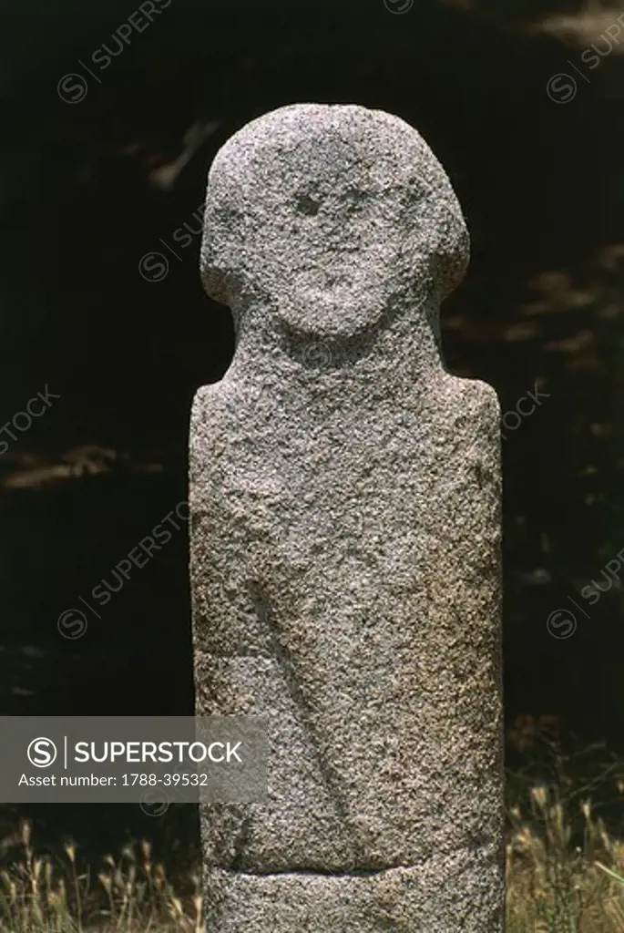 France - Corsica - Filitosa prehistoric archaeological site. Anthropomorphic menhir statue.