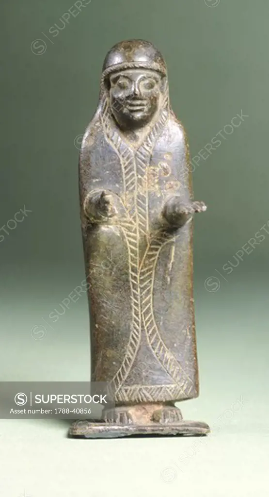 Female figure in bronze making an offering, from Montalcino (Tuscany). Etruscan Civilization, ca 600 BC.