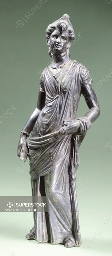 Female figure in bronze making an offering, from Montecchio near Cortona (Tuscany). Etruscan Civilization, 300-250 BC.