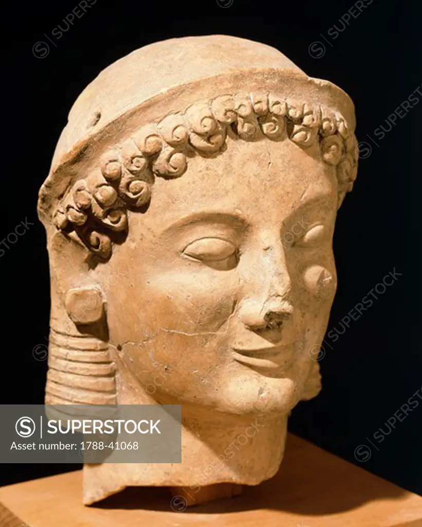 Female head, terracotta sculpture from Medma near Rosarno, Calabria, Italy. Ancient Greek civilization, Magna Graecia, 6th Century BC.