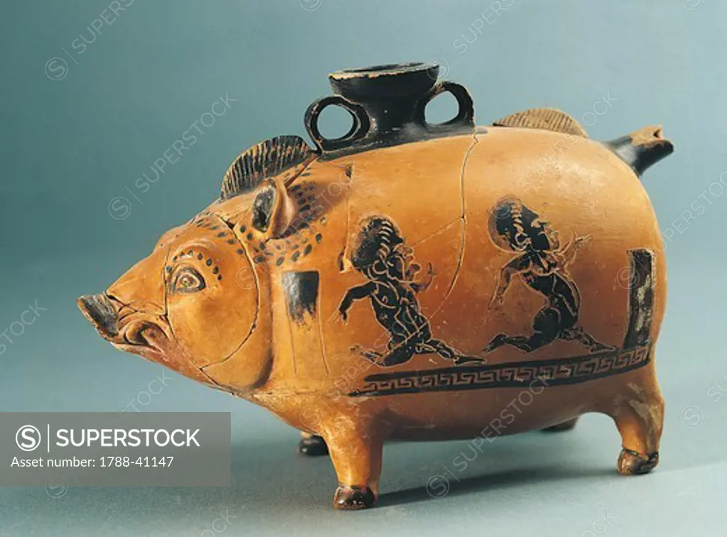 Askos shaped like of boar showing a grotesque scene depicting two dwarves chasing each other, black-figure pottery from Calabria, Italy. Ancient Greek civilization, Magna Graecia.