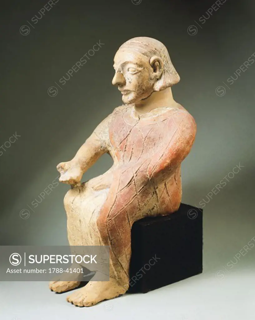 Seated figure in pottery. Etruscan Civilization, 7th Century BC.