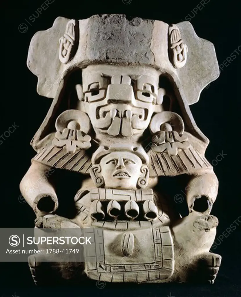 Terracotta funeral urn with anthropomorphic breastplate. Artefact from the village of Xoxocotlan, Mexico. Zapotec Civilization, classical period, 200-900.