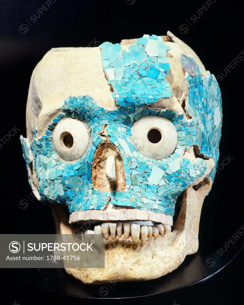 Skull decorated with turquoise from the Treasury of Tomb 7 in Monte Alban, Mexico, side view. Mixtec Civilization, post-classical period, 14th-15th Century.