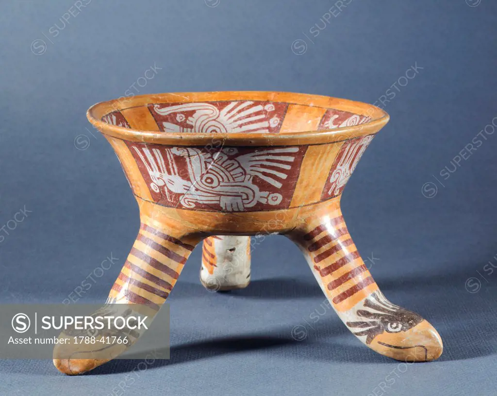 Terracotta polychrome tripod vase with feet decorated with the heads of eagles. Artefact from San Pablo Huitzo, Mexico. Mixtec Civilization, post-classical period 900-1521.
