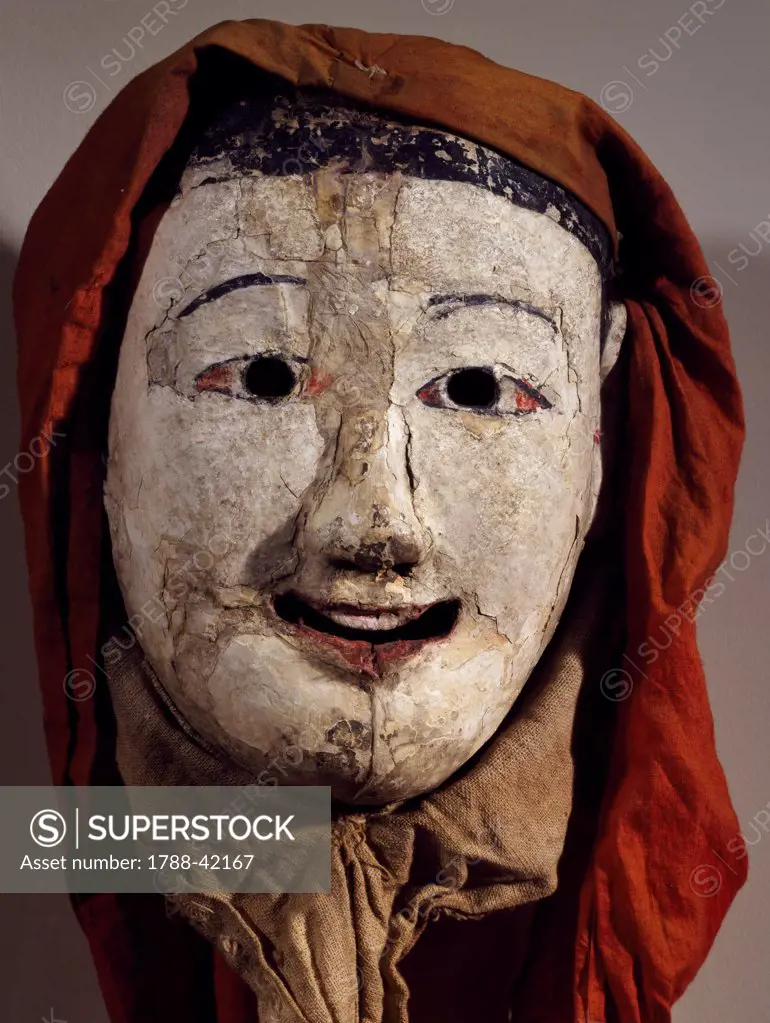 Painted wooden mask and fabric depicting a young monk. Korean civilization, Choson period, 18th century.