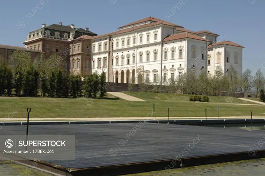 Italy, Piedmont, Venaria Reale, Royal Palace with covered artificial lake in foreground