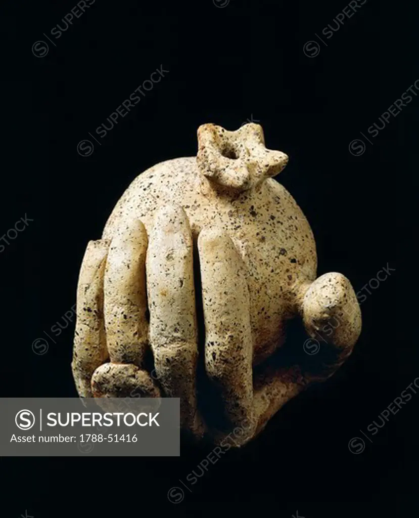 Terracotta sculpture, from the site of Lavinium-Pratica di Mare, Lazio, Italy. Detail of a hand presenting a pomegranate. Latin Civilization, 5th Century BC.