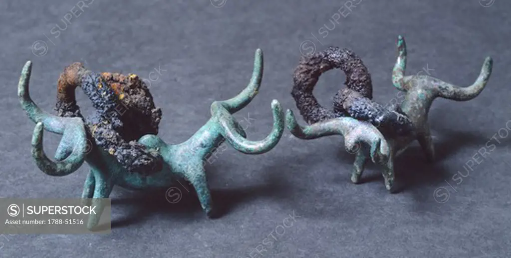 Pendants with double bull-shaped protomes, bronze, Marche, Italy. Piceno Civilization, 6th Century BC.